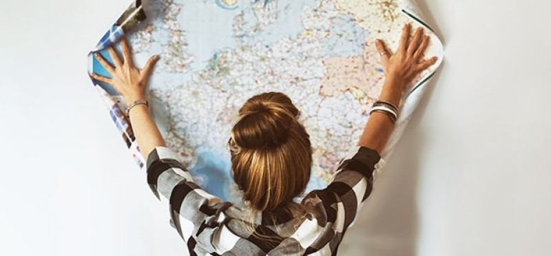 A woman looking at a map
